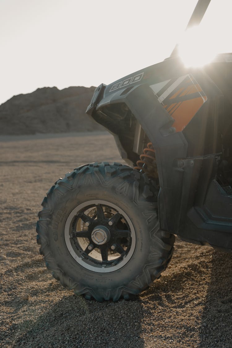 An All Terrain Vehicle On Sand