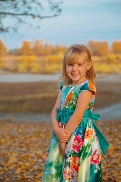 Free Happy little girl in autumn park Stock Photo