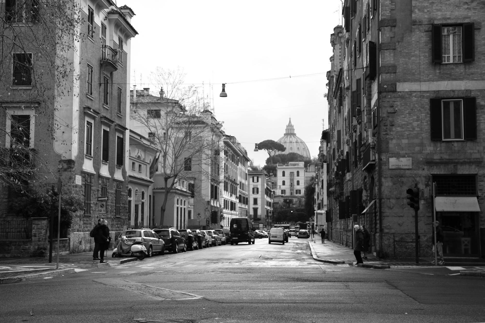 https://www.pexels.com/photo/anonymous-pedestrians-walking-on-old-city-street-near-typical-residential-buildings-5977355/