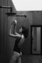 Woman in Black Tank Top Holding Round Ball