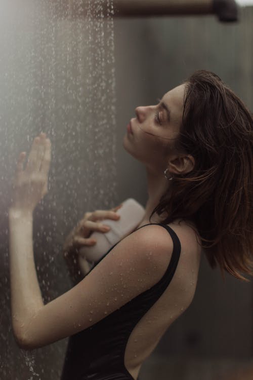 Close-up Photo of Woman taking a Shower 