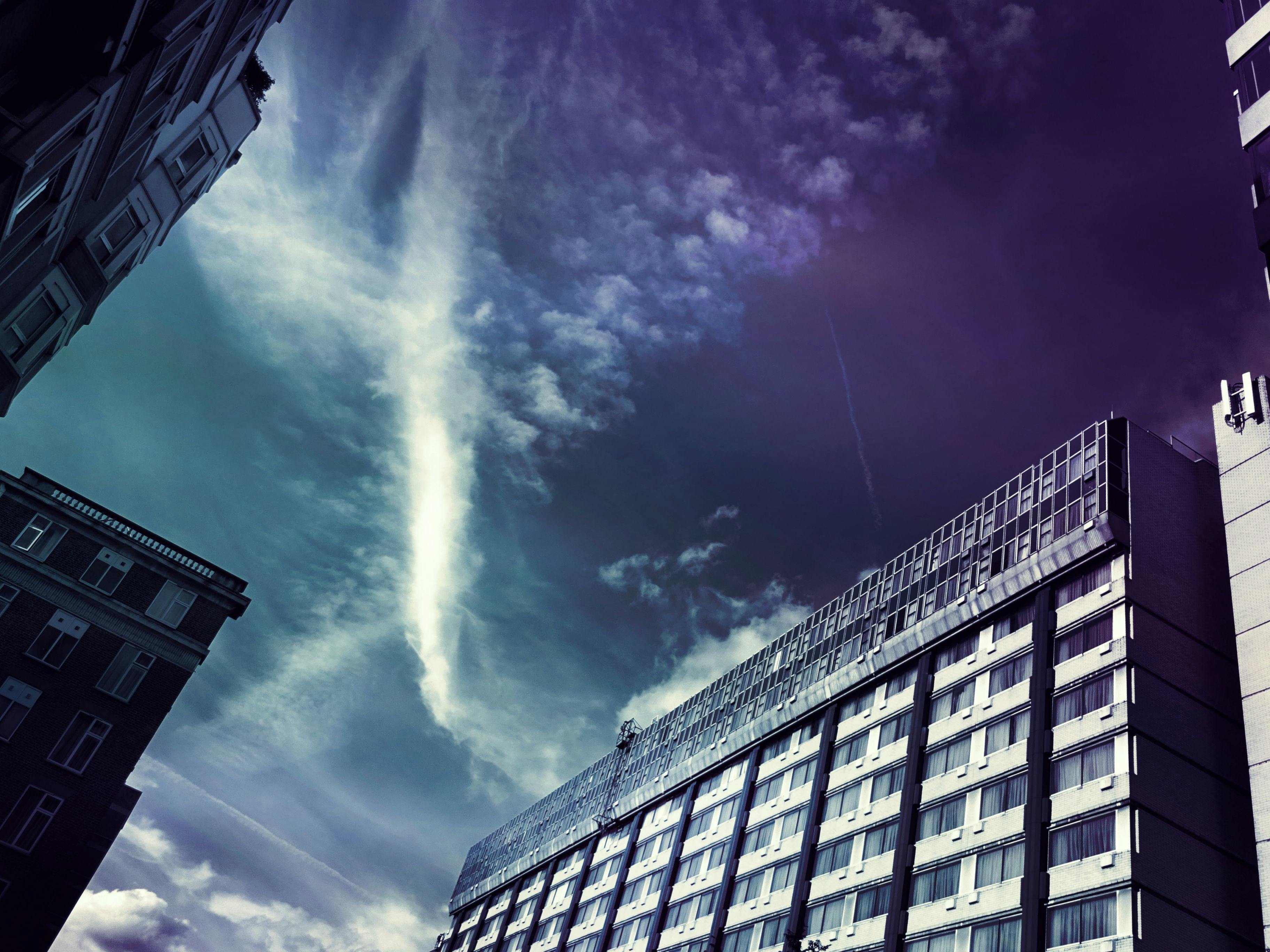 Five Gray Concrete Buildings Under Blue Sky · Free Stock Photo