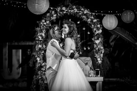 A loving couple shares a joyful dance at a beautifully decorated wedding.