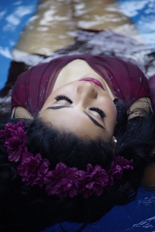 Woman with Makeup Posing in Pool