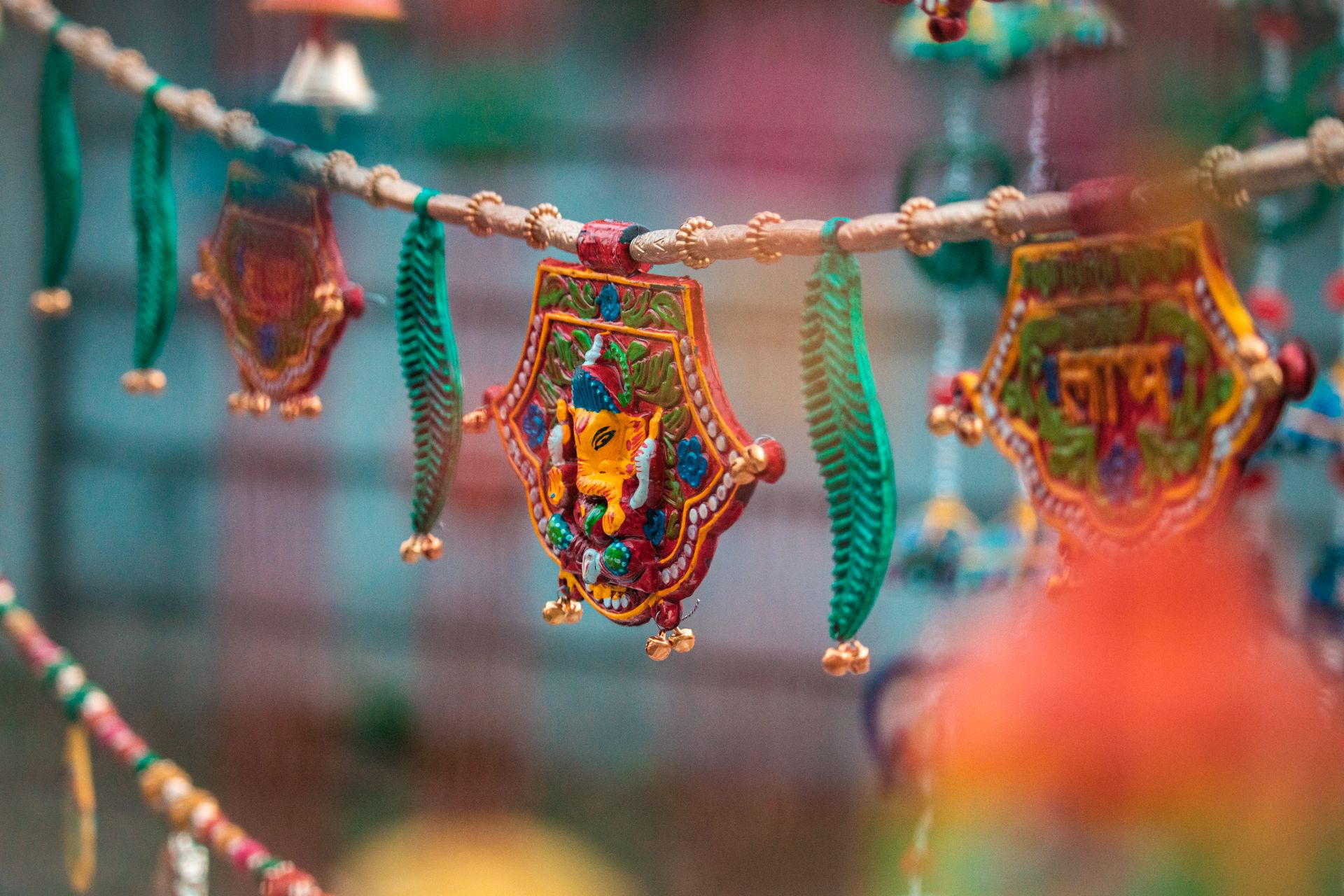 Colorful handcrafted Indian decorations hanging with selective focus, showcasing vibrant cultural artistry.