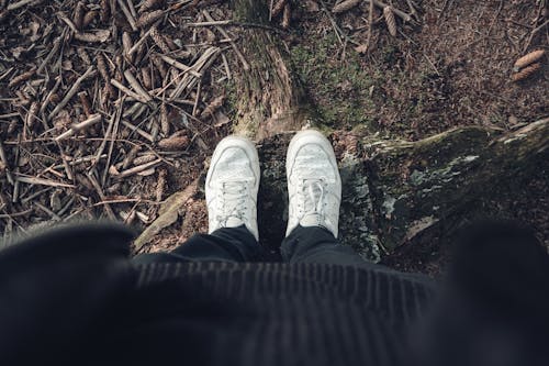 High-Angle Shot of Person Wearing White Sneakers