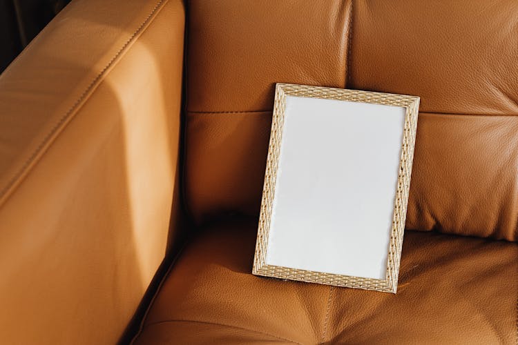 Picture Frame On Brown Leather Couch