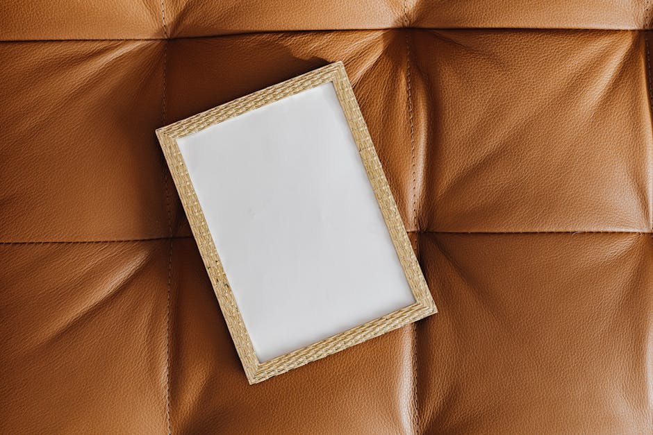 A wicker picture frame on brown leather surface, ideal for mockup designs.