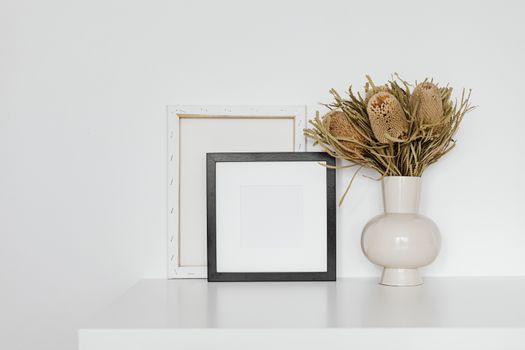 Dried Showy Banksia Flowers on White Ceramic Vase 