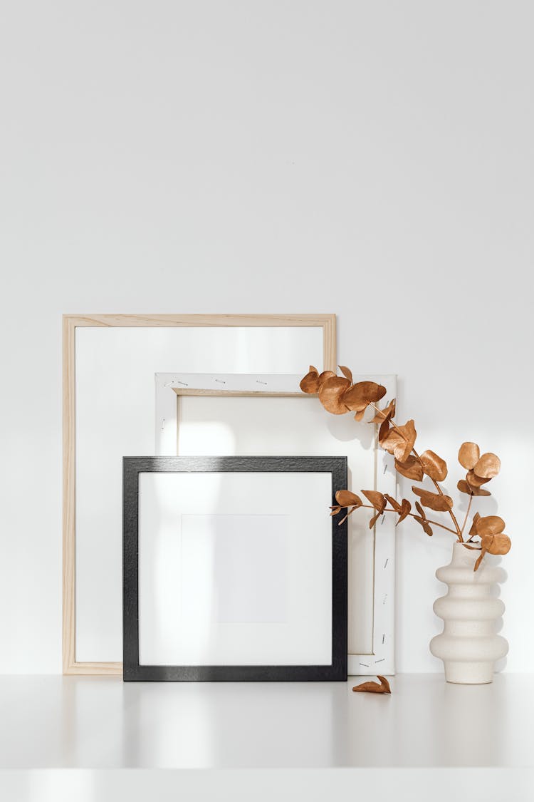 Wooden Picture Frames Near The Eucalyptus Leaves 