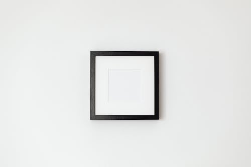 Black Picture Frame Hanging in a White Wall 