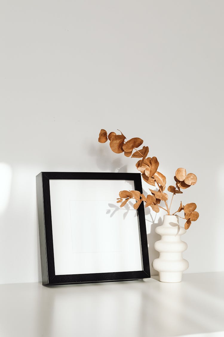 Brown Eucalyptus Leaves In Ceramic Vase 