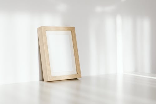 Close-Up Shot of a Wooden Frame on the Wall