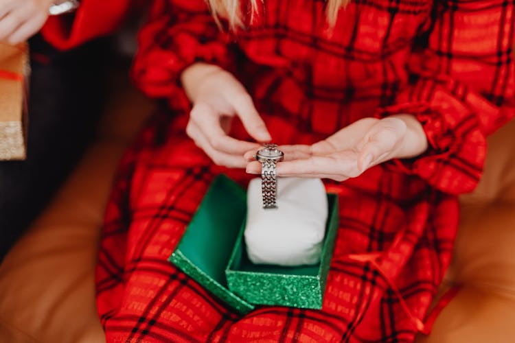 Person Holding A Silver Wrist Watch 