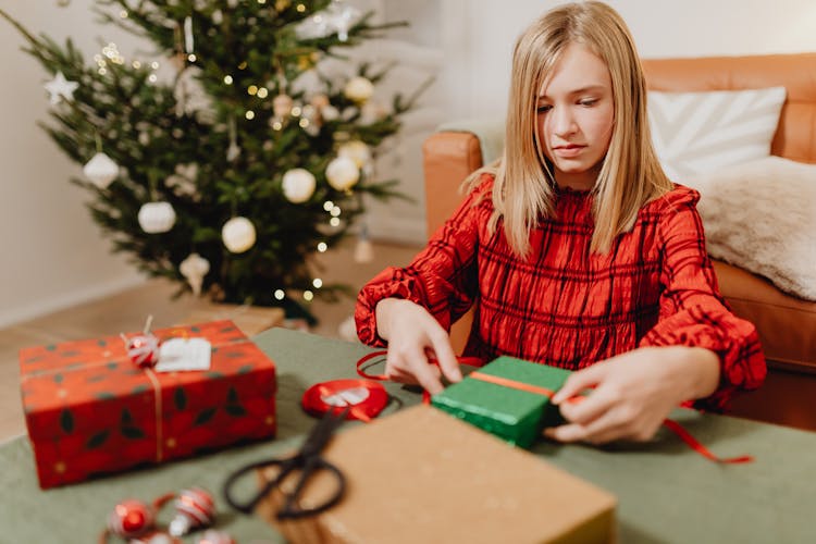 A Girl Wrapping Christmas Presents