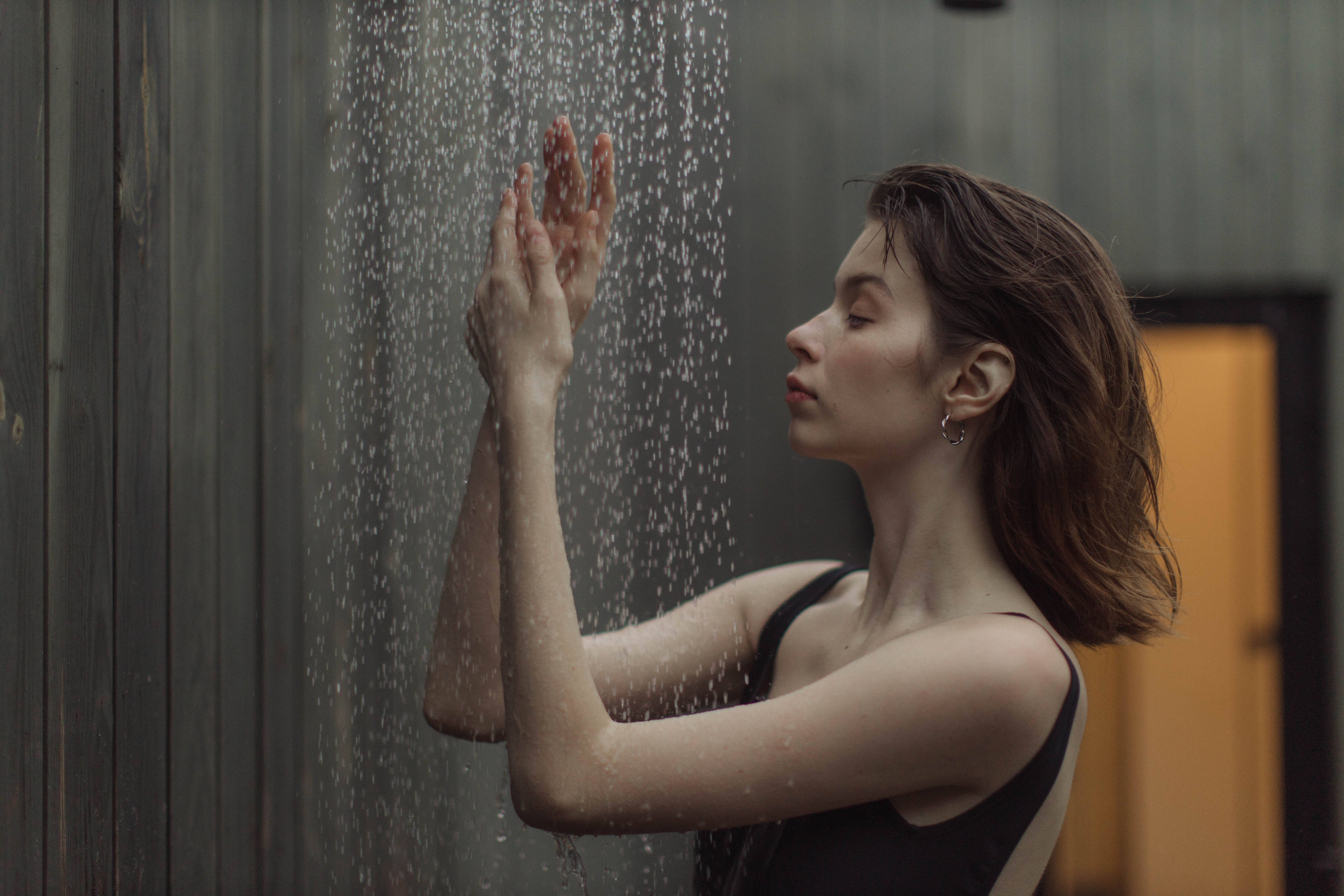 Side View of a Woman Taking a Shower · Free Stock Photo