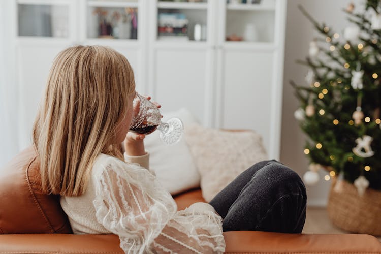 Woman Drinking Wine At Christmas