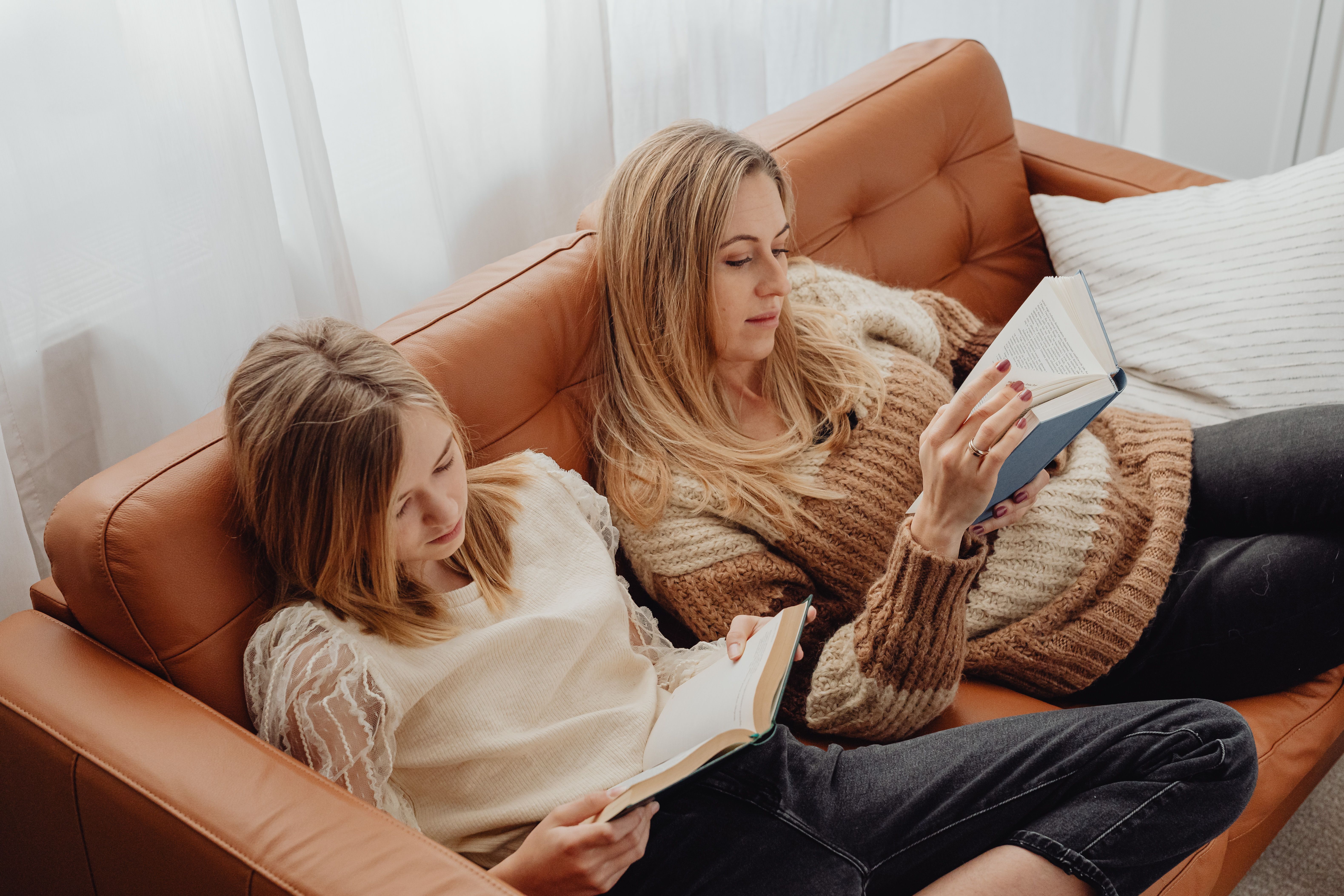 A family relaxing comfortably in their living room, with a focus on a pleasant home atmosphere maintained by a smart thermostat - smart thermostat installation bluffdale, ut