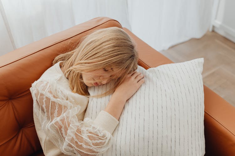 A Girl Sleeping On A Sofa