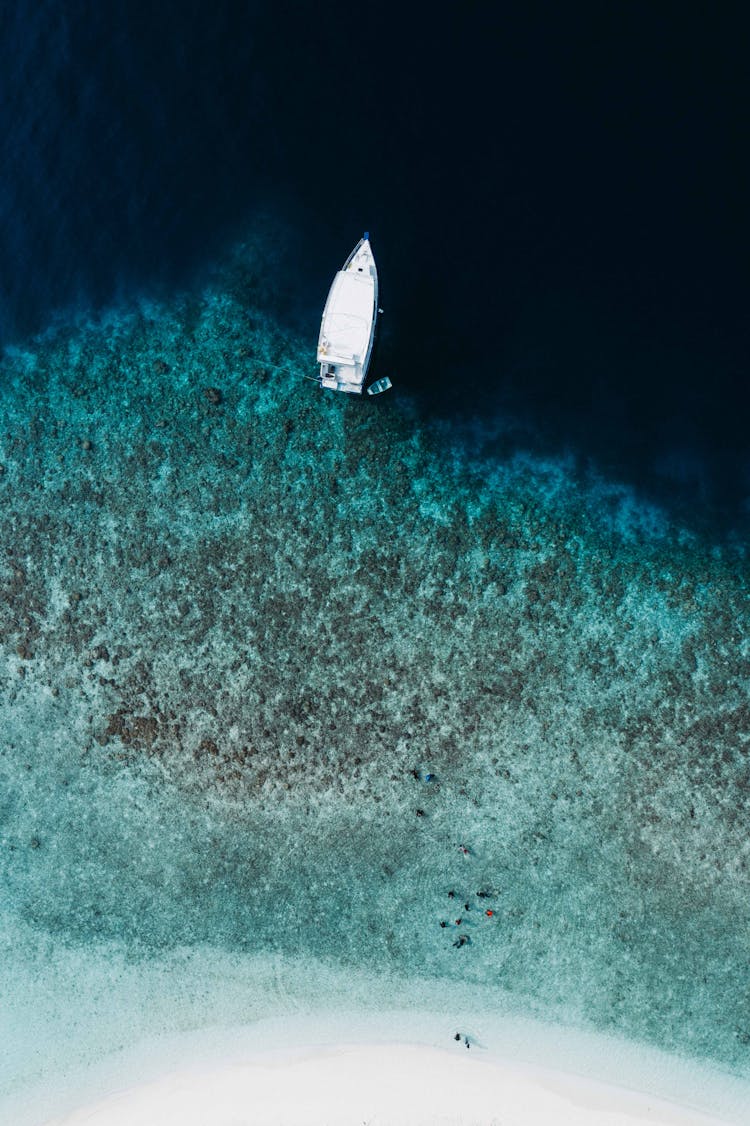 Aerial Modern Motorboat Moored On Shallow Sea Coast