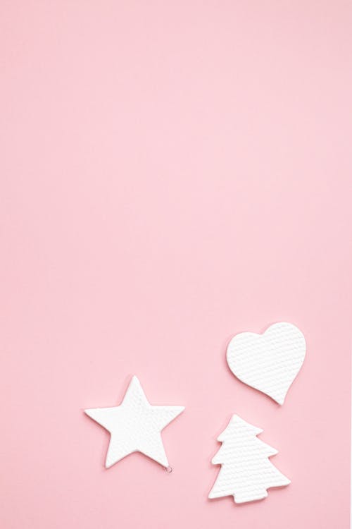 Simple Christmas Decorations on a Pink Background