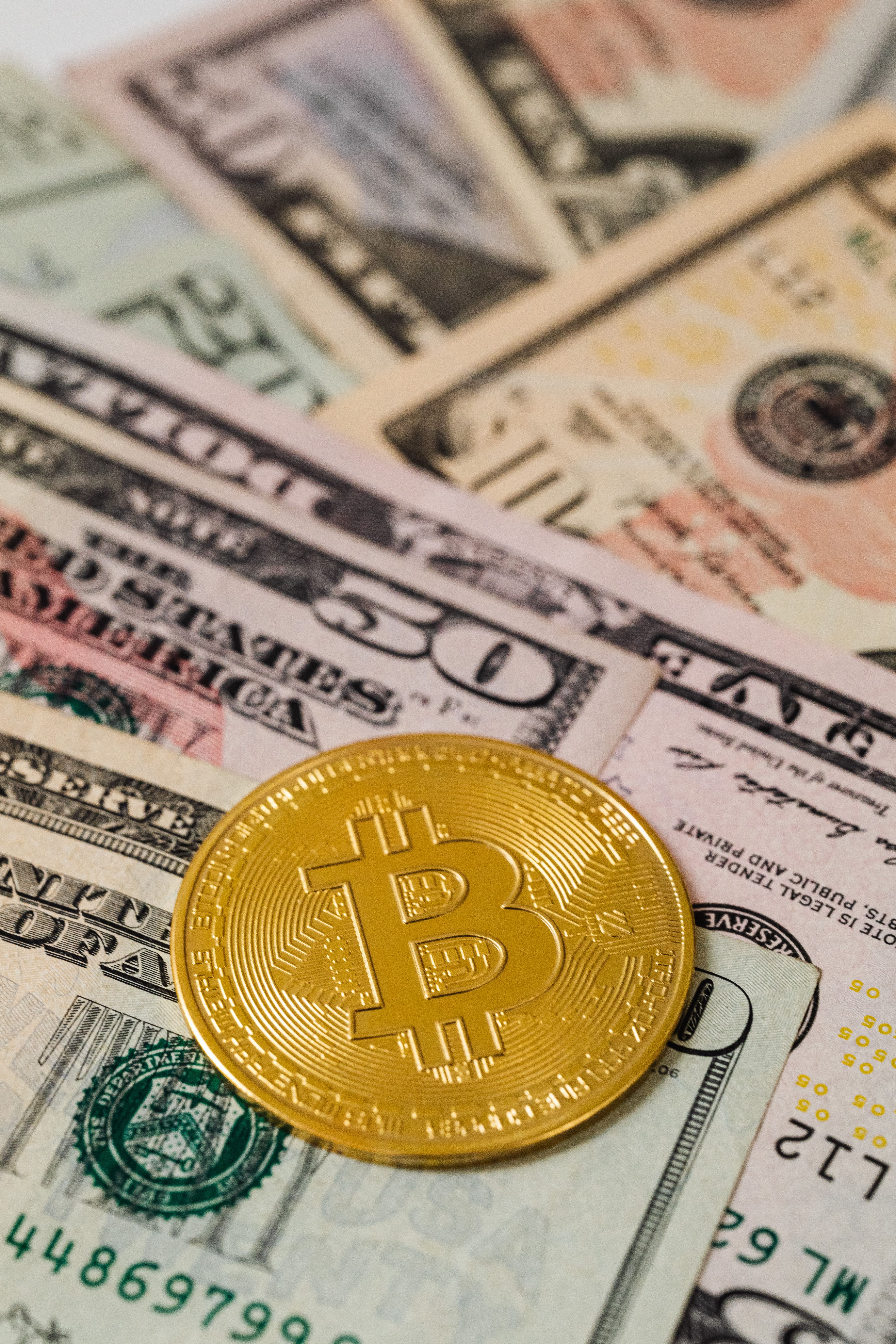 Bitcoins and U.s Dollar Bills · Free Stock Photo