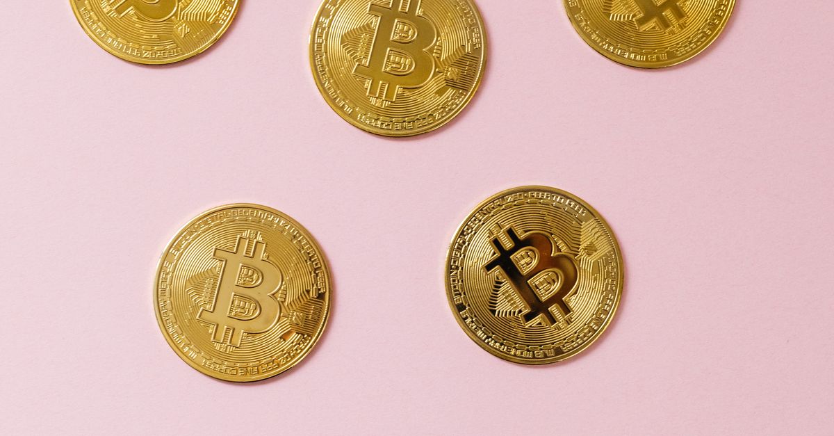 Round Coin Gold Round Coins on Pink Surface · Free Stock Photo