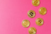 Gold Round Coins on Pink Surface