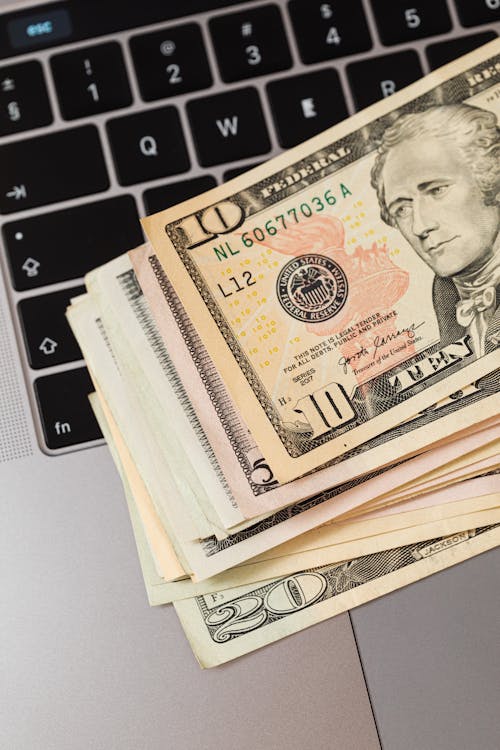 Free Close-up of Dollar Bills on Keyboard  Stock Photo