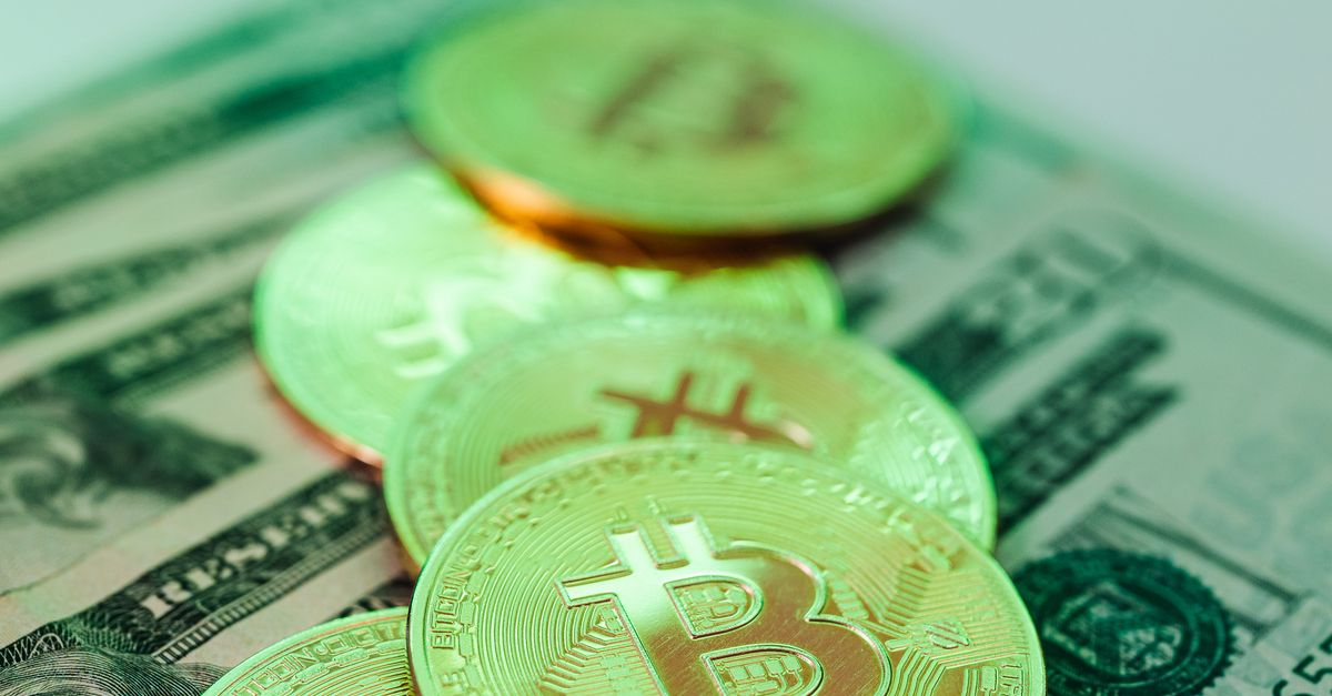 Bics Money Bitcoins on Top of Cash · Free Stock Photo