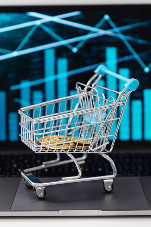 Free Gold Bitcoin Coins in a Miniature Shopping Cart  Stock Photo