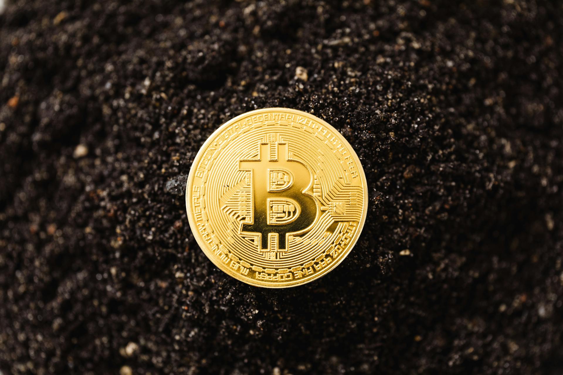 Close-Up Shot of a Bitcoin on the ground