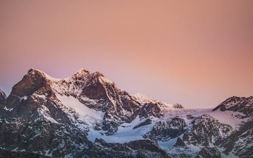 Snow Covered Mountain During Golden Hour 