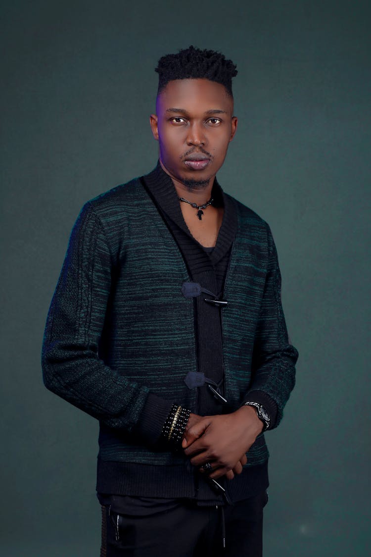 Portrait Of Man Posing On Studio Background