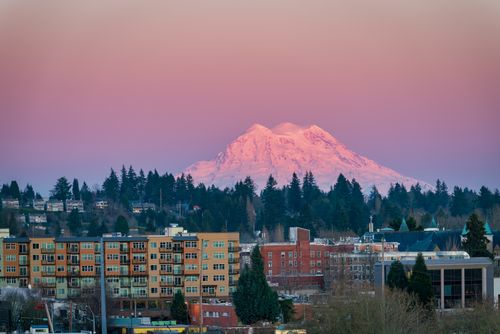 Free Breathtaking view of Olympia cityscape with Mount Rainier glowing at sunset. Stock Photo