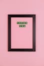 Words from Letters in Frame on Pink Background
