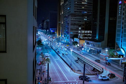 Modern city street with road at night time