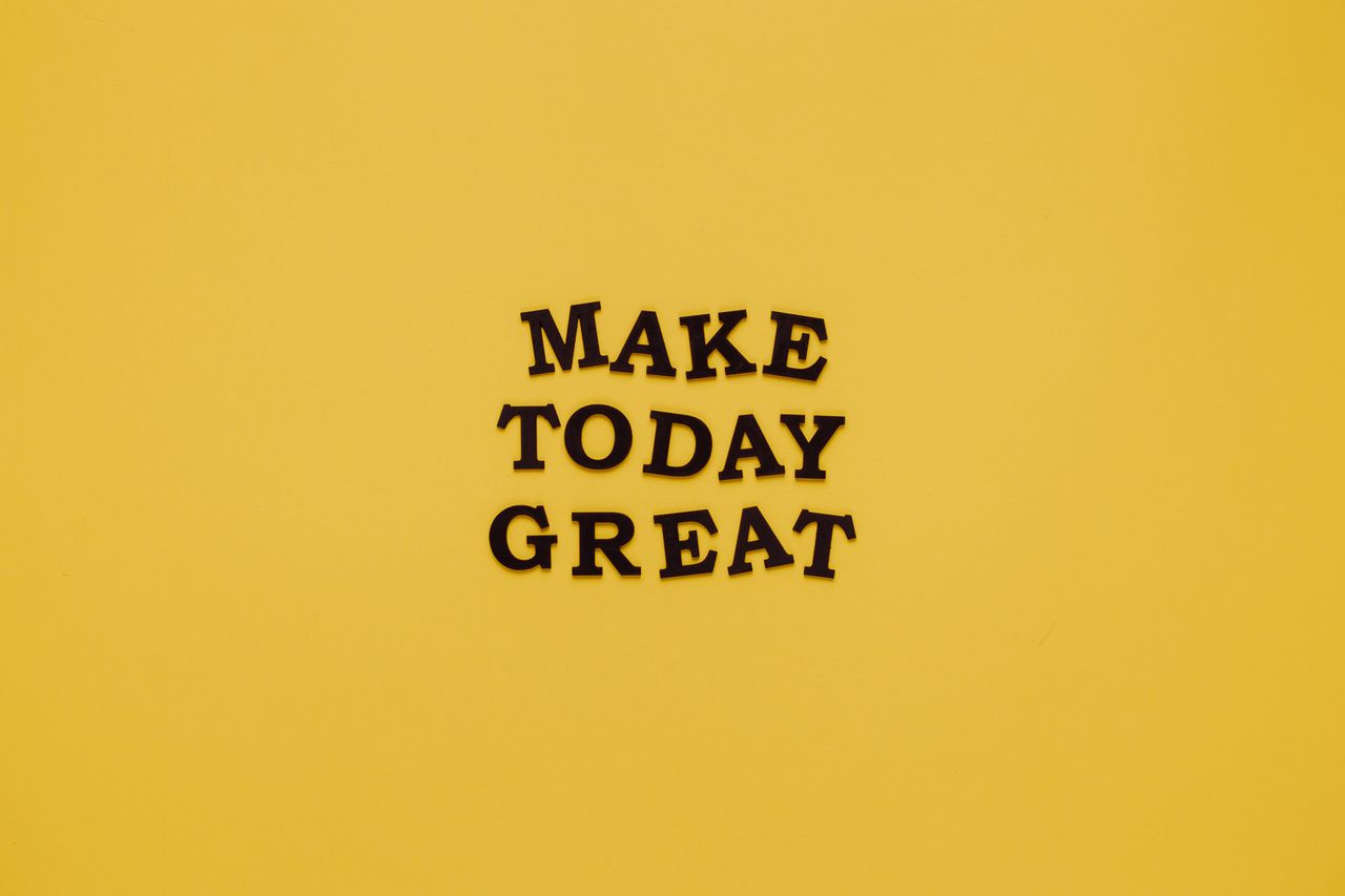simple and motivational quote make today great on a minimalist yellow