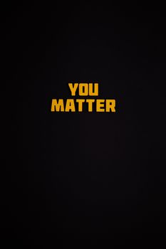 Bold text 'You Matter' on a dark background, emphasizing importance and positivity.