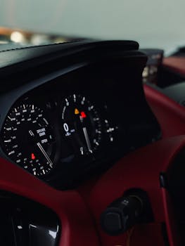 Close-up view of a sleek car dashboard showcasing modern instrumentation and design.