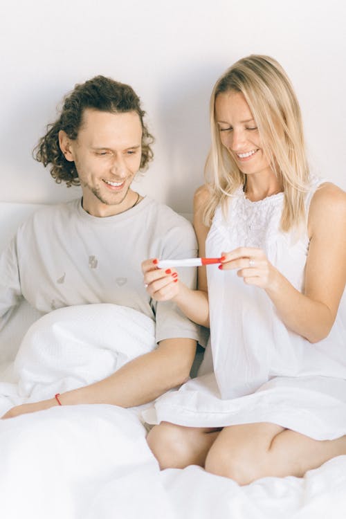 Happy Couple Looking at the Pregnancy Test