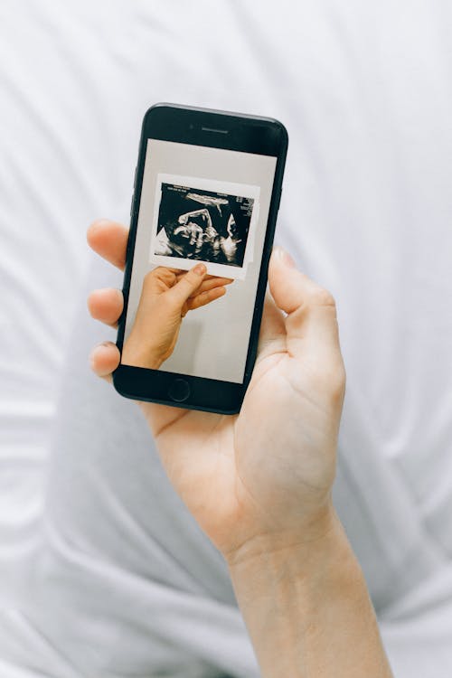 Person Holding Black Iphone 5