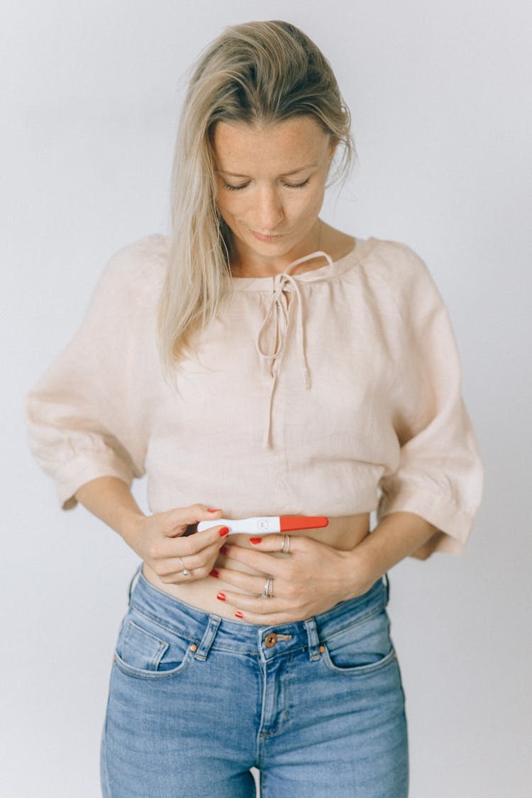 Woman Holding A Positive Pregnancy Test