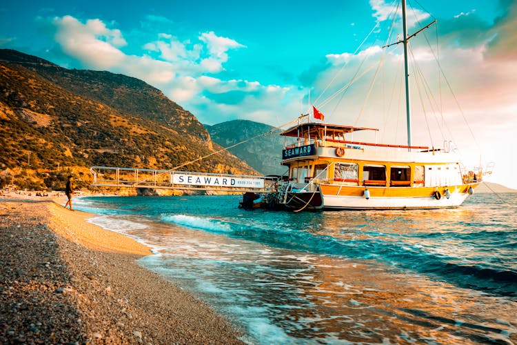 Passenger Boat Moored On A Seashore 