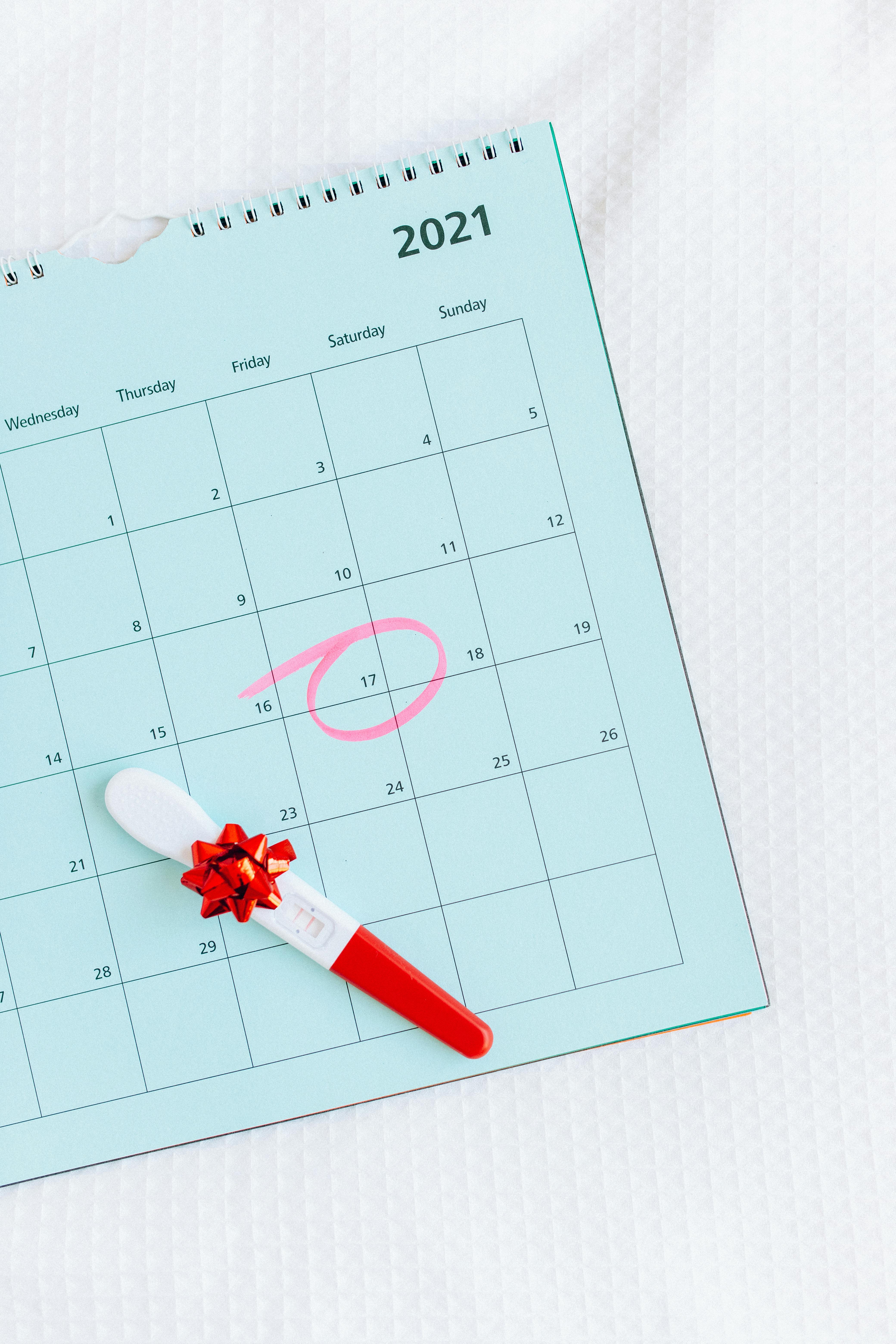 pregnancy test on a calendar