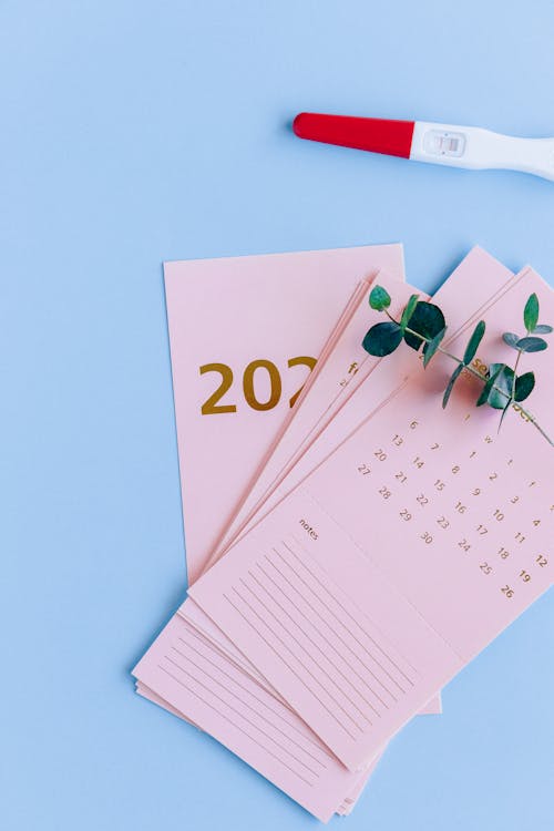 Pink Calendar Cards on Blue Background 
