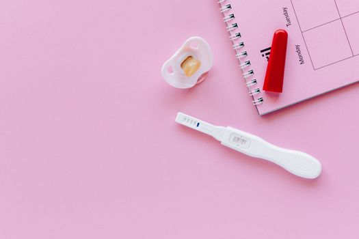 White and Pink Plastic Measuring Tool