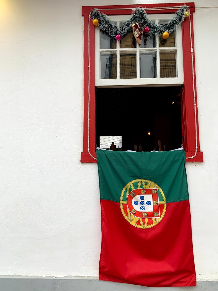 Flag Hanging On A White Wall