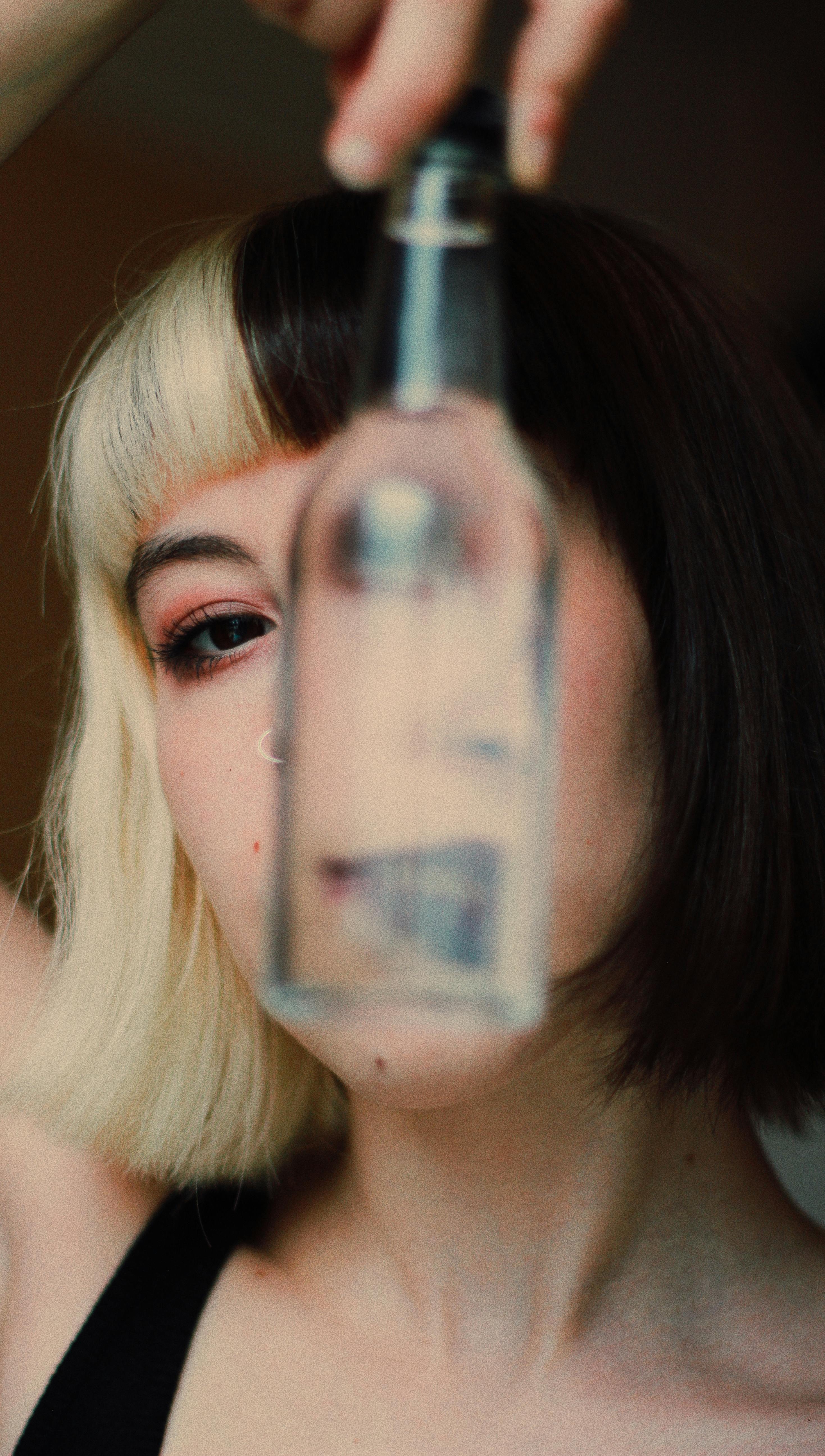 Woman holding bottle of water Stock Photo by ©sheftsoff 67696563