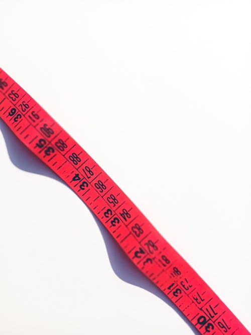 Measuring tape on white surface